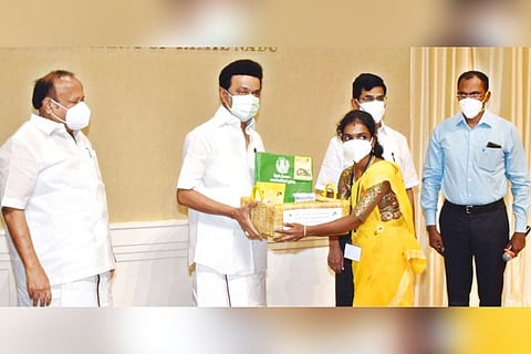 Stalin distributing a garden kit to grow nutritive vegetables to a beneficiary in Chennai on Monday