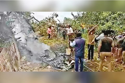 Locals try to douse the fire