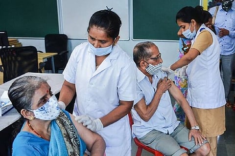 Health workers administer Covid vaccine doses to senior citizens (Image credit: PTI)