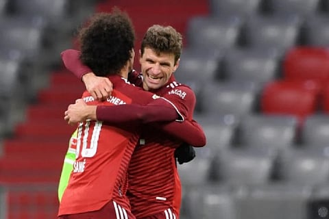 Leroy Sane and Bayern Munich's German forward Thomas Mueller celebrate a goal (Image credit: AFP)