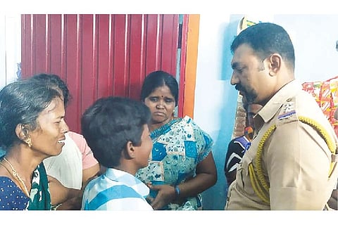 Pettai Inspector M Hariharan consoles the family of deceased school boy Anbazhagan on Saturday