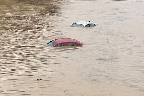 Cars marooned in the floods. Image Courtesy: Reuters