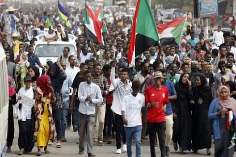 Thousands of Sudanese protesting in the road (Image Courtesy: IANS)