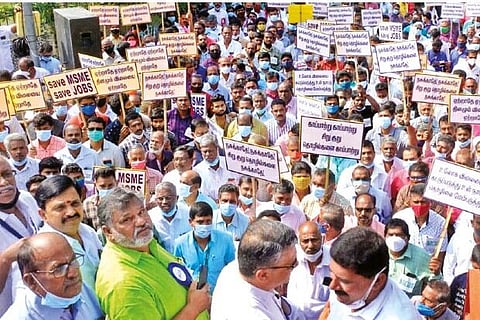 Members of various industrial associations staging a demonstration in Coimbatore on Monday
