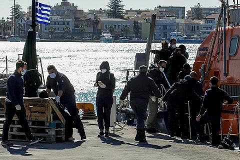 The bodies of three unidentified men were recovered from the sea (Credit: Reuters)