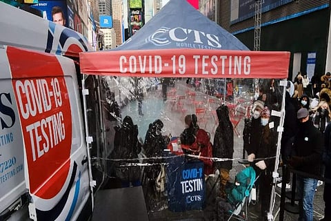 People wait in queue to get tested for Covid-19 at a testing facility in New York City (Credit: AFP)