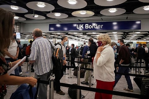 Arriving passengers queue at UK Border Control (Credit: Reuters)