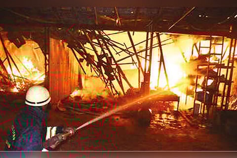 Firemam dousing the fire.