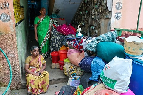 Residents sitting outside with their necessities (Photo credit: Justin George)