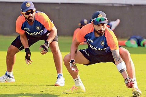 Ajinkya Rahane (left) and Virat Kohli take part in a Team India training session