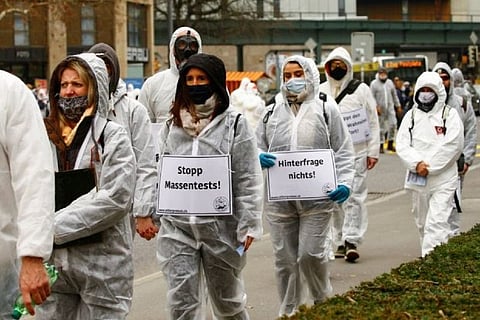 Swiss march in lakeside tax haven to protest COVID-19 lockdown