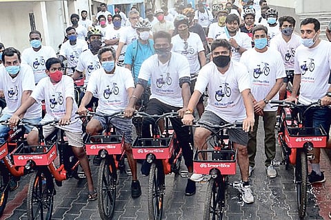 Corporation Commissioner rides an e-bike on Sunday at an event to spread awareness