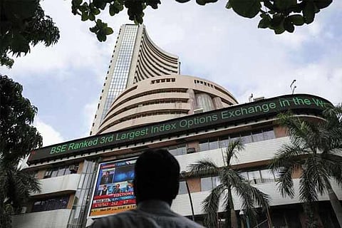 Markets end flat after choppy trade, post weekly gains