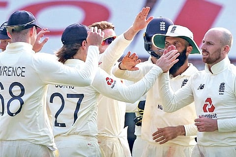 England celebrates the dismissal of Rohit Sharma