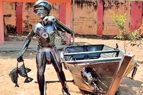 Sculpture of a fisherman made out of scrap metal