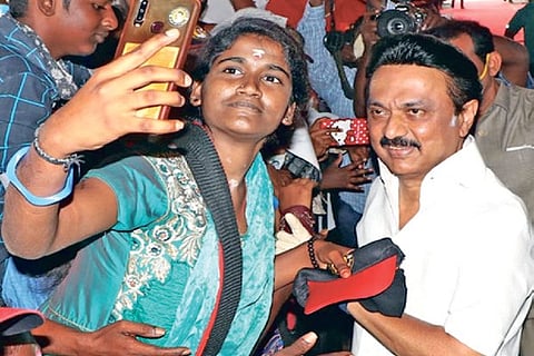 DMK leader MK Stalin posing for a selfie with a party worker in Coimbatore on Friday