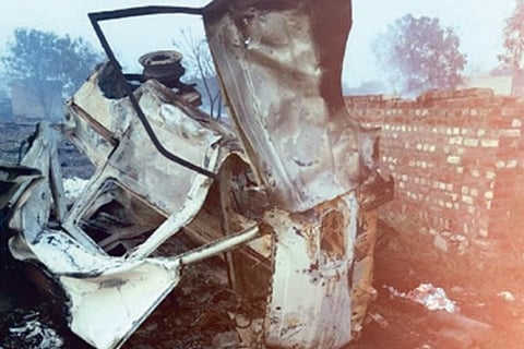 Mangled remains of a vehicle.
