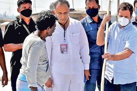 Rahul Gandhi scrapping salt in a pan at Kovankadu in Thoothukudi on Saturday