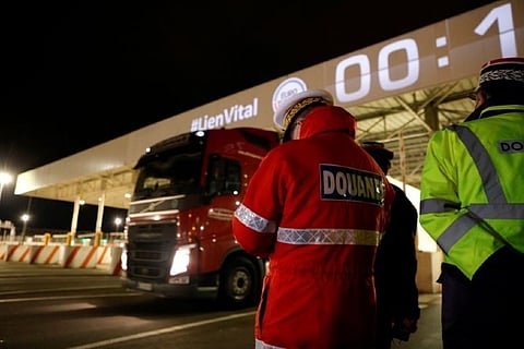 In northern France, first trucks cross new customs border with UK