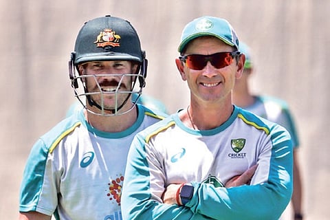 David Warner and Australia coach Justin Langer
