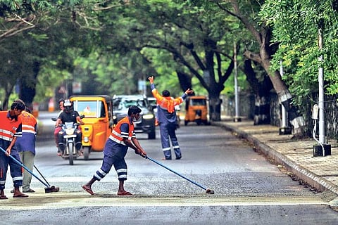 Besant Avenue Road being cleaned by Corporation workers on Friday