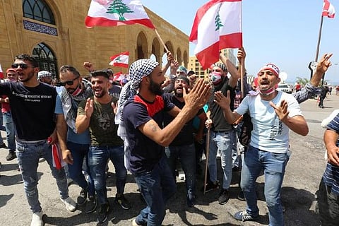 Lebanese PM urges citizens to stop protests against lockdown