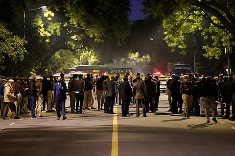 Security officials are seen at the site of an explosion near the Israeli embassy in New Delhi