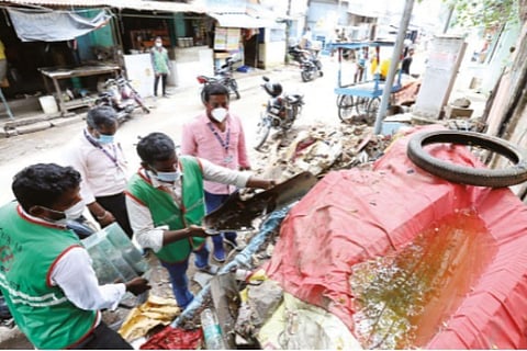 Corporation staff clearing stagnant water at Periamedu