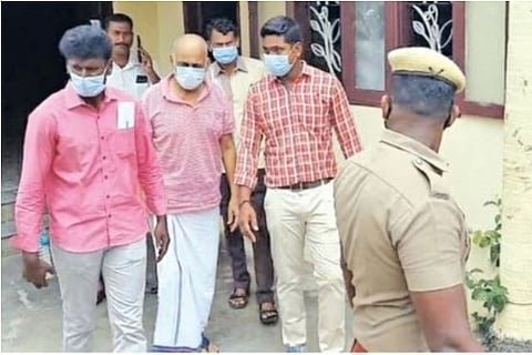 Officials taking Siva Shankar Baba in custody