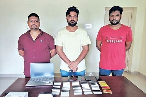 The trio nabbed by Kanathur police during a vehicle check on Wednesday with the seized debit and cre