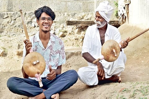 Sound Mani and Arunachalam (right) with the Kinnaram instrument