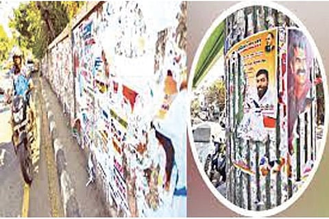 One of the city walls seen defaced with posters