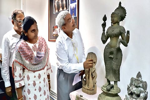 ADGP Abhay Kumar Singh examining idols seized from Kilpauk