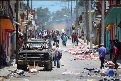 A glimpse of a burnt car (Credit: Reuters)