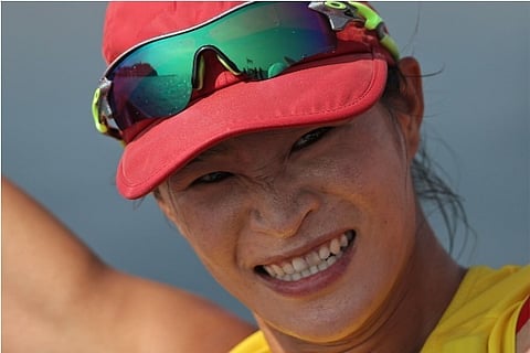 Lu Yunxiu of China is all smiles after winning gold in sailing (Credit: Reuters)