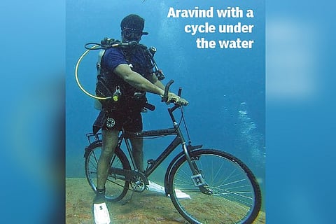 Diving instructor cycles underwater to raise awareness about cycling