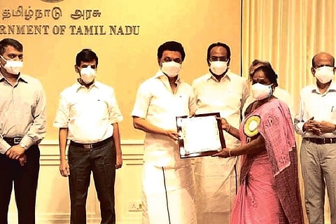 Chief Minister MK Stalin handing over orders of increased monthly assistance of Rs 3,000 to artistes