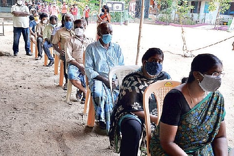 People waiting in queue to get vaccinated