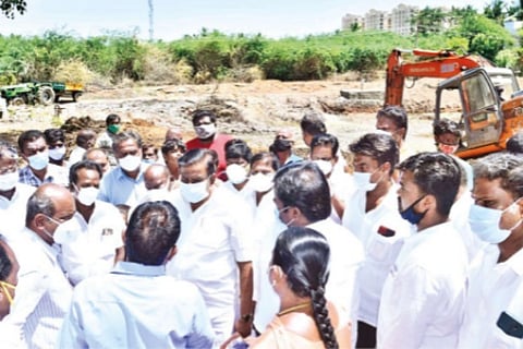 Minister KN Nehru inspecting desilting works at a pond in Tiruchy on Wednesday