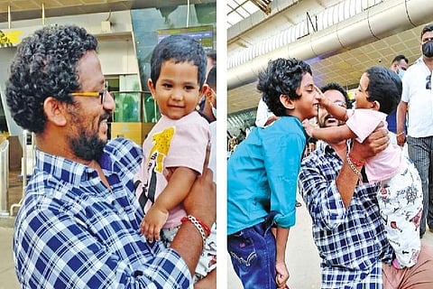 The boy with his father and older brother at Tiruchy airport