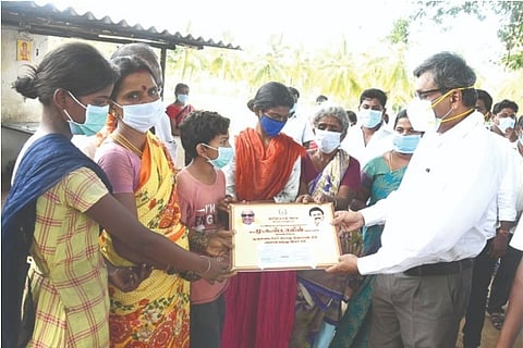 Salem District Collector S Karmegam hands over the financial assistance to the kin of the deceased f