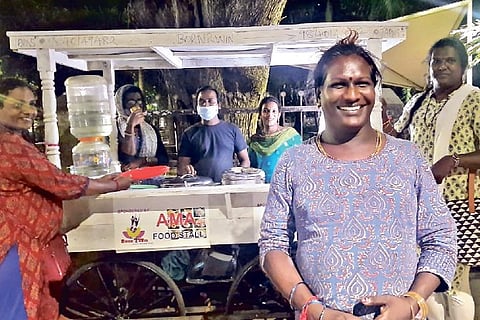 Anjana Balu in front of AMA food stall