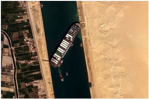 Container ship stuck in Suez Canal 'partially refloated'