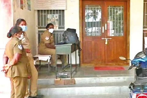 Cops waiting outside the locked station on Tuesday