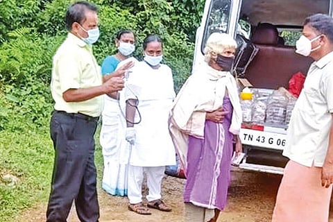 Healthcare personnel sensitising a woman to get vaccinated at Kuttychatanmoola tribal village.