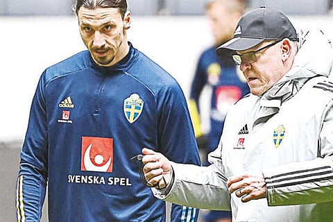 A file photo of Sweden?s Zlatan Ibrahimovic and coach Janne Andersson during a training session