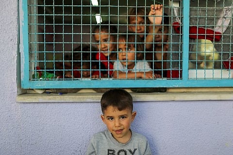 U.N. agency says 52,000 displaced in Gaza, Amnesty wants war crimes investigation