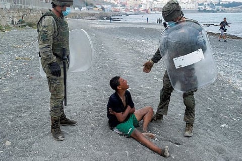 Europe I'd rather die than go back, Moroccan migrant boy tells Spanish soldier