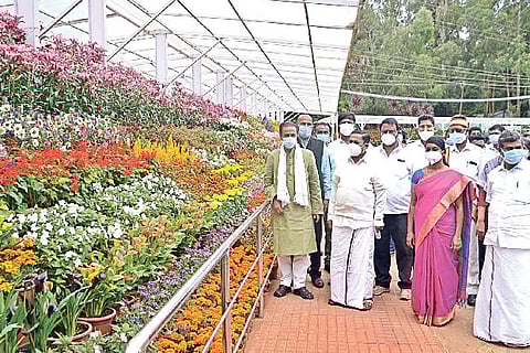 Forest Minister K Ramachandran accompanied by officials at the Government Botanical Garden