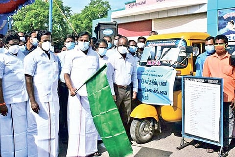 Municipal Administration Minister KN Nehru flagging off the sale of essentials from mini vans